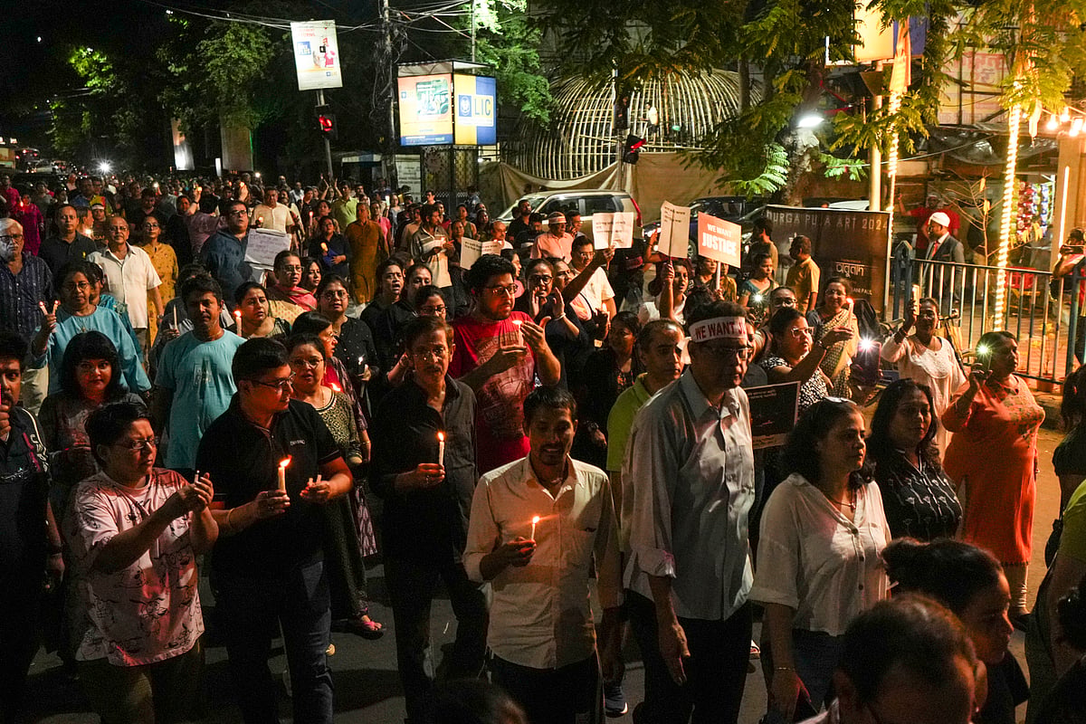 PTI : People during a candlelight march in protest against the alleged rape and murder of a trainee woman doctor at the RG Kar Medical College and Hospital, in Kolkata, Wednesday